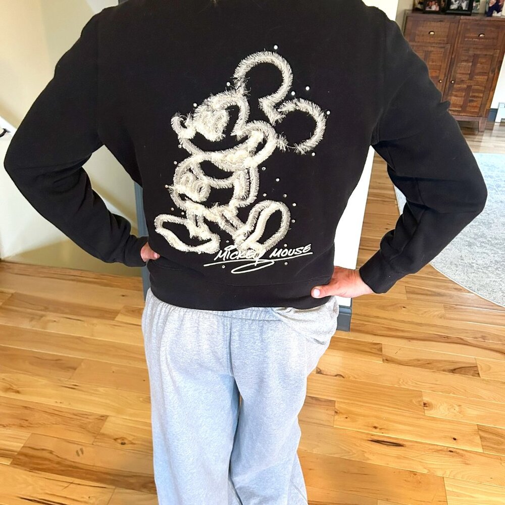 Disney Black Zip up w/ collar, Disney logo on Chest Wht Mickey on back, Junior L